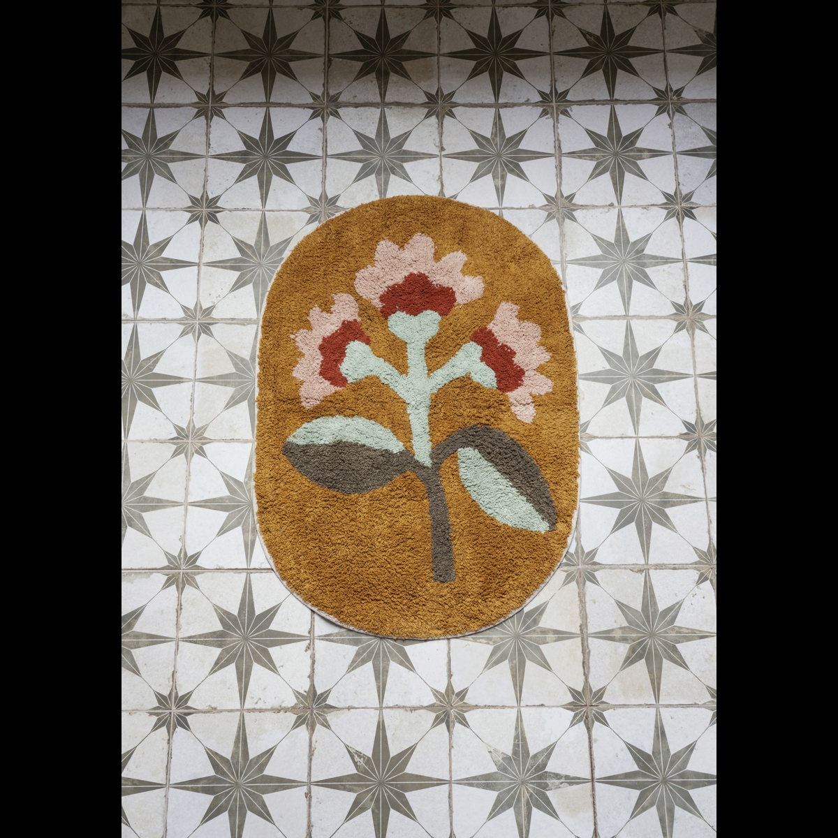 Oval tufted bath mat