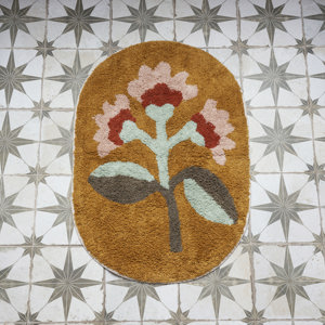 Oval tufted bath mat
