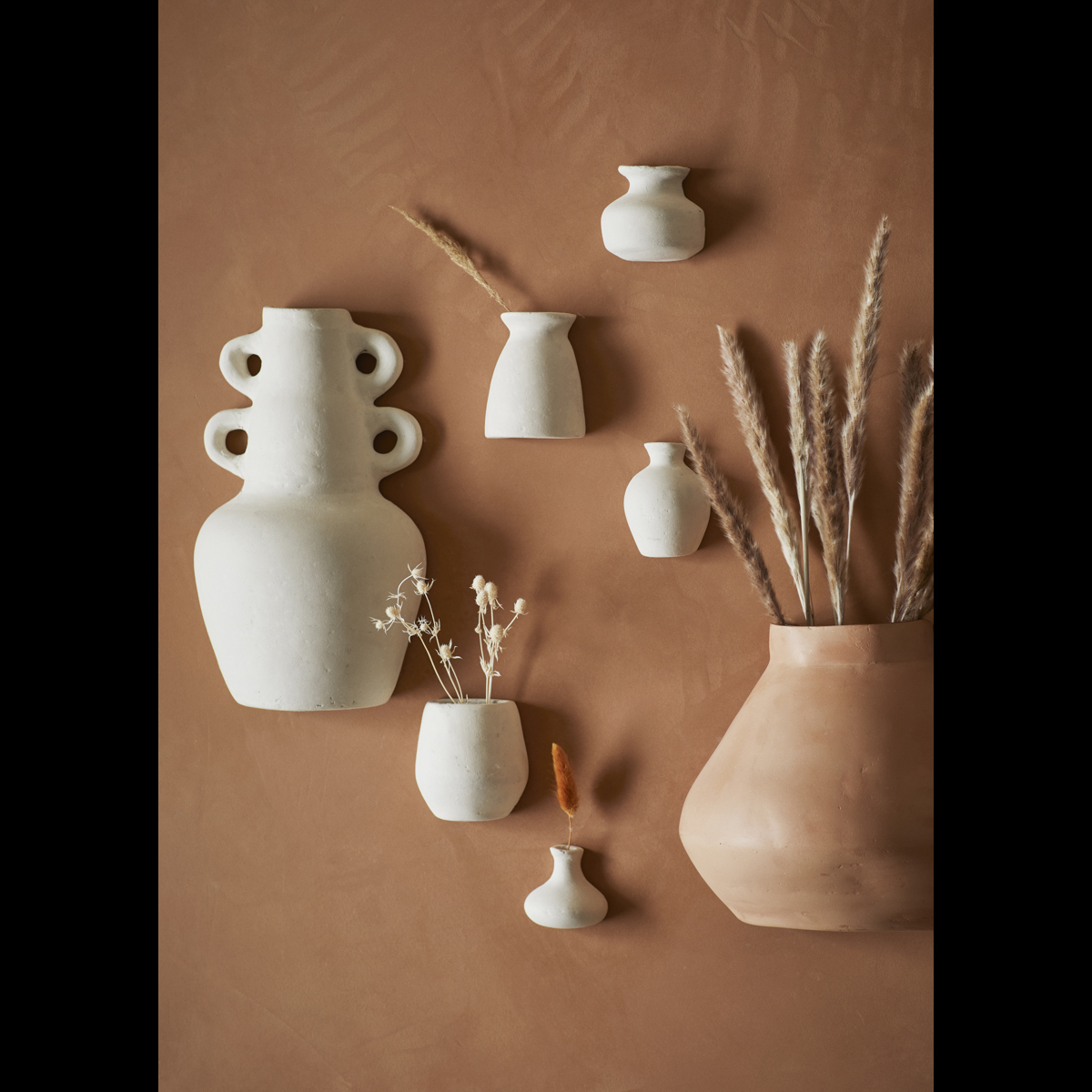 Wall-mounted terracotta vase