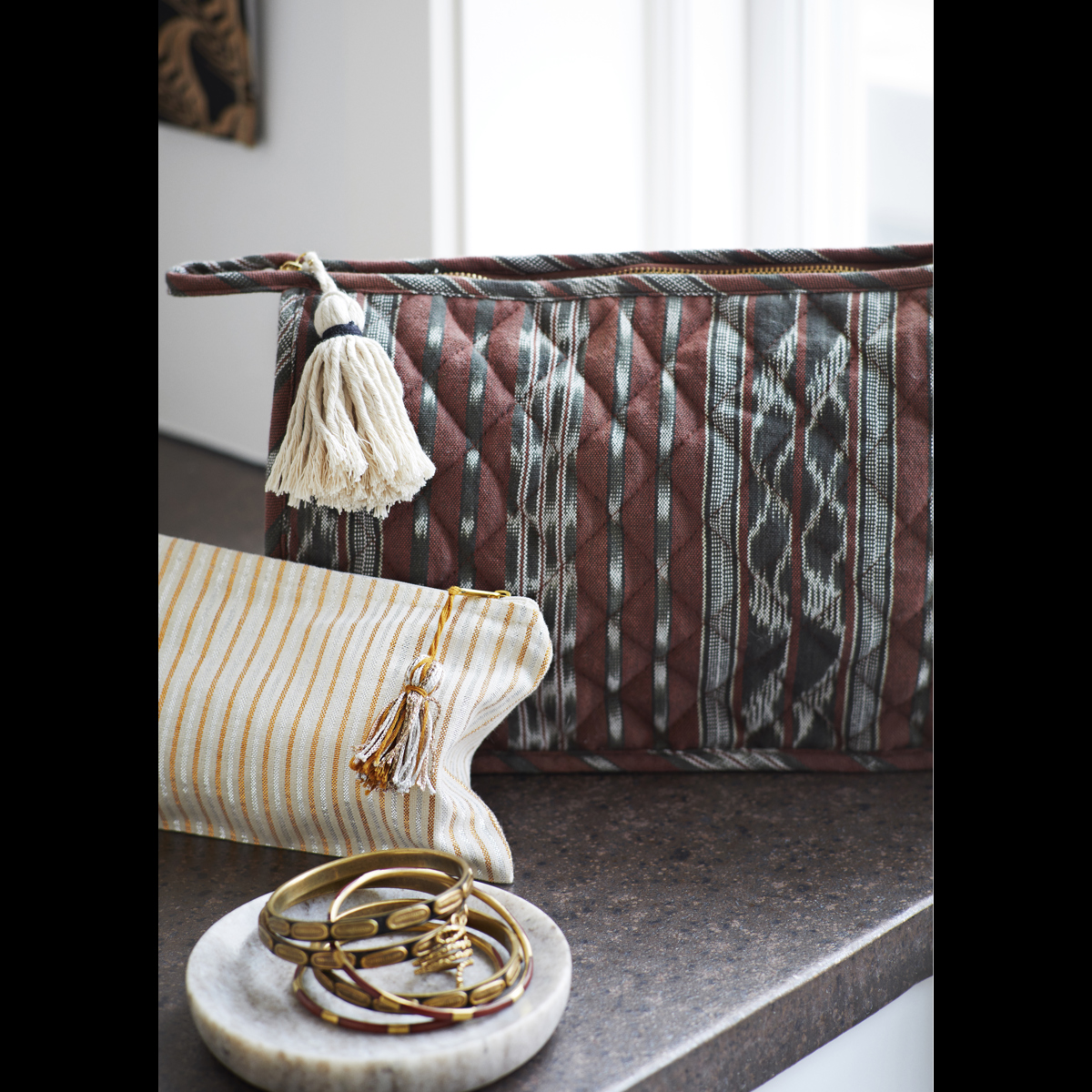 Quilted ikat washbag w/ tassel