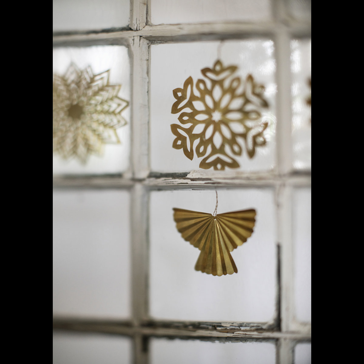 Hanging brass snowflakes