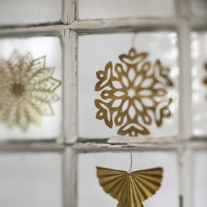 Hanging brass snowflakes